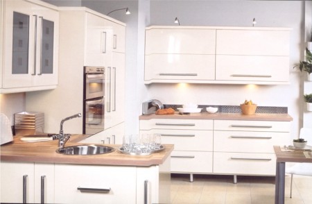 The Keld cream gloss kitchen design is available from Gee's Kitchens, Bedrooms & Flooring of Kildare.